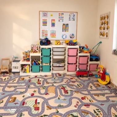 Toys in colourful boxes and an English learning board