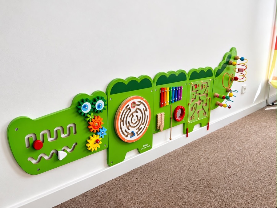 The crocodile activity wall with mazes and a xylophone